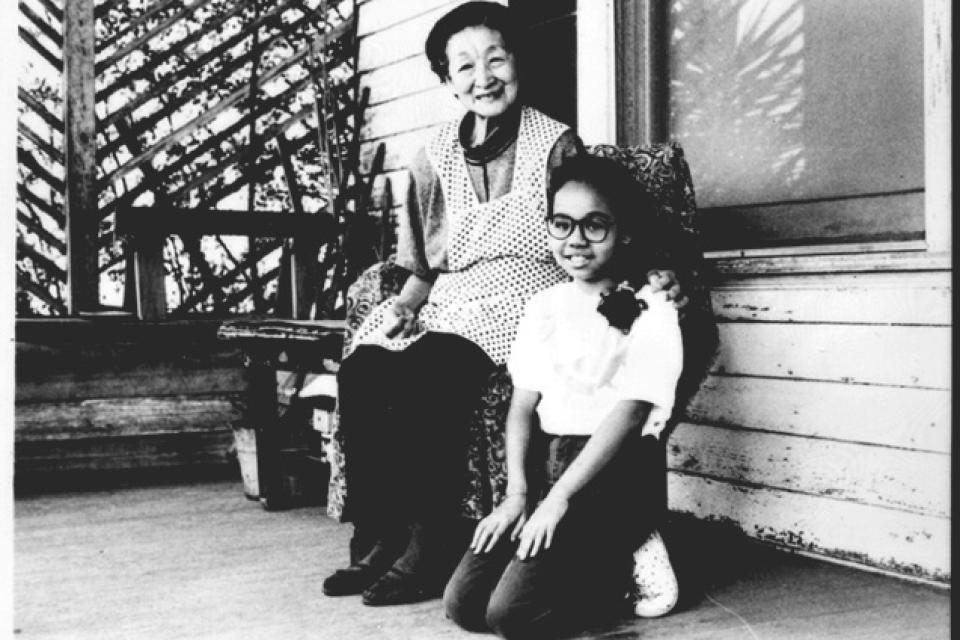 Aiko Fujita and granddaughter Simone on front porch